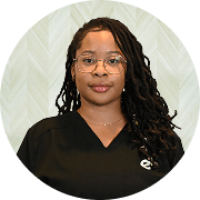 Kelechi Anyakee , MSN, APRN, FNP-BC, Nurse Practitioner at Fem Excel, smiling in black medical uniform.