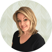 Angela Bucci, MSN, APRN, FNP-BC, Nurse Practitioner at Fem Excel, smiling in black medical uniform.