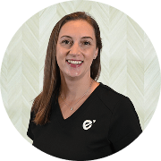 Ashley Fellows, FNP-C, Nurse Practitioner at Fem Excel, smiling in black medical uniform.