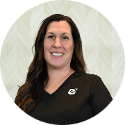 Michelle Hass-Roe, MSA, APRN, CNP, Nurse Practitioner at Fem Excel, smiling in black medical uniform.