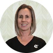 Angela Hillner, MSN, APRN, FNP-BC, Nurse Practitioner at Fem Excel, smiling in black medical uniform.