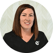 Jana Mervine, APRN, Nurse Practitioner at Fem Excel, smiling in black medical uniform.