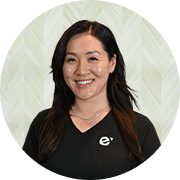 Jenny W. Song, MS, FNP-BC, Nurse Practitioner at Fem Excel, smiling in black medical uniform.