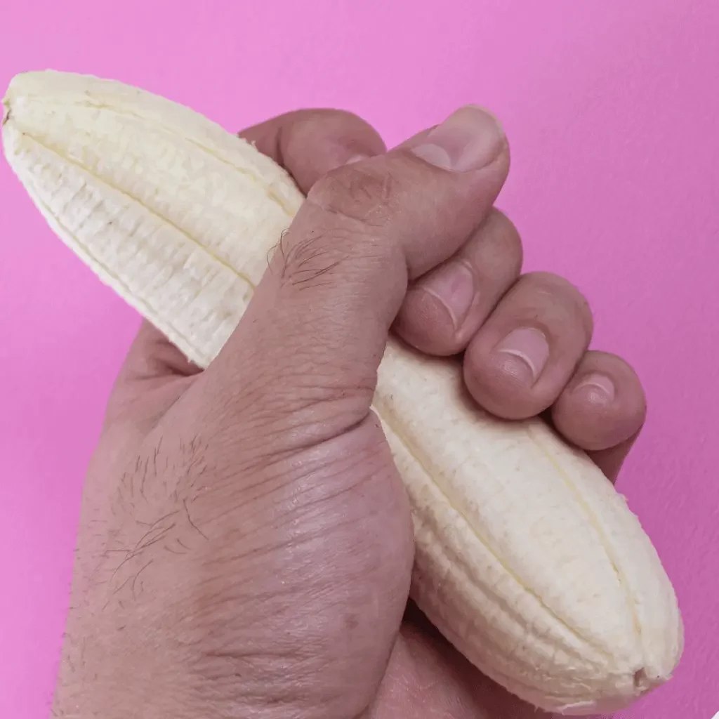 Hand holding a banana