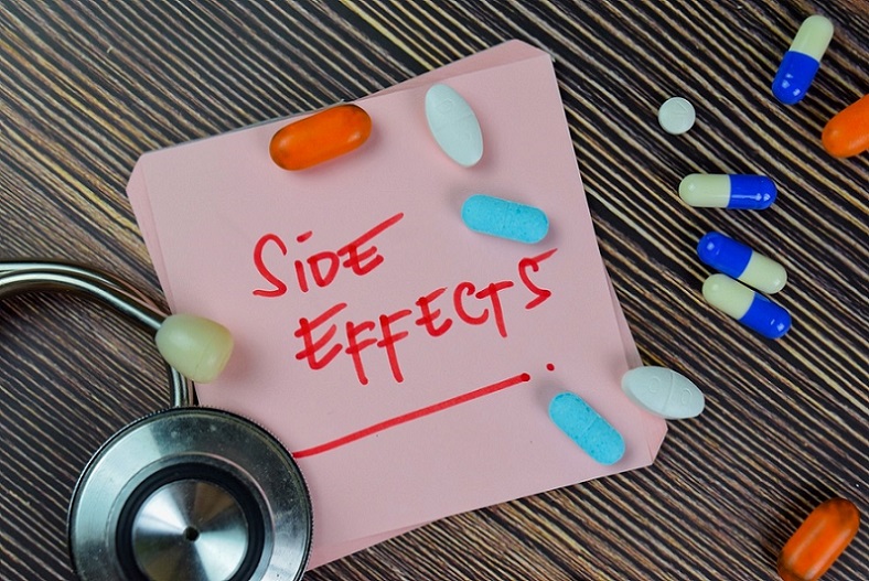 zma-and-testosterone-side-effects-written-on-sticky-note-next-to-stethoscope-and-medicine-pills