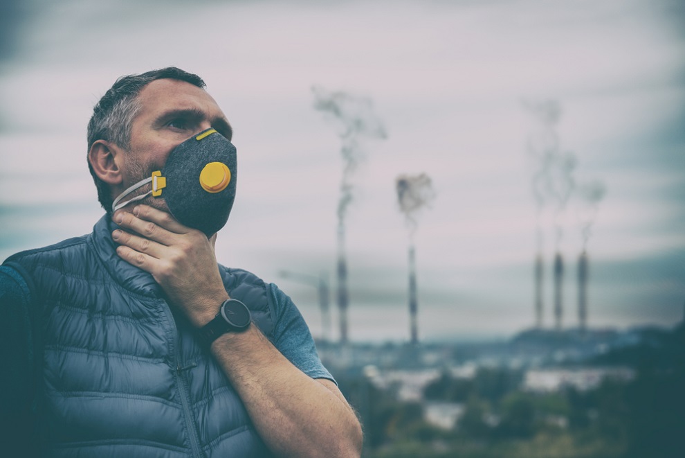 air-pollution-impact-man-wearing-anti-pollution-mask-with-dense-smog-in-background