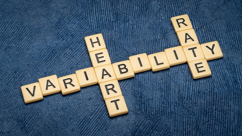 HRV-and-wellbeing-scrabble-tiles-displaying-heart-rate-variability-on-dark-blue-background