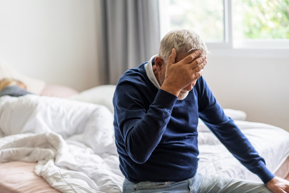 stroke-risk-aging-elderly-man-with-head-in-his-hand-showing-stroke-symptoms