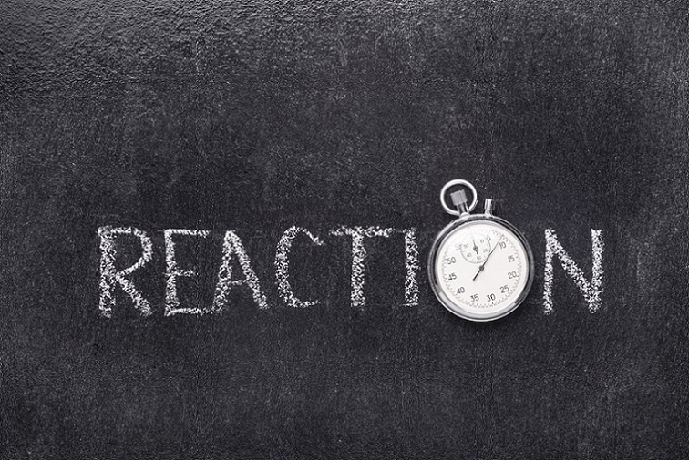 reaction-time-and-aging-chalkboard-with-the-word-reaction-but-with-stopwatch-instead-of-letter-o