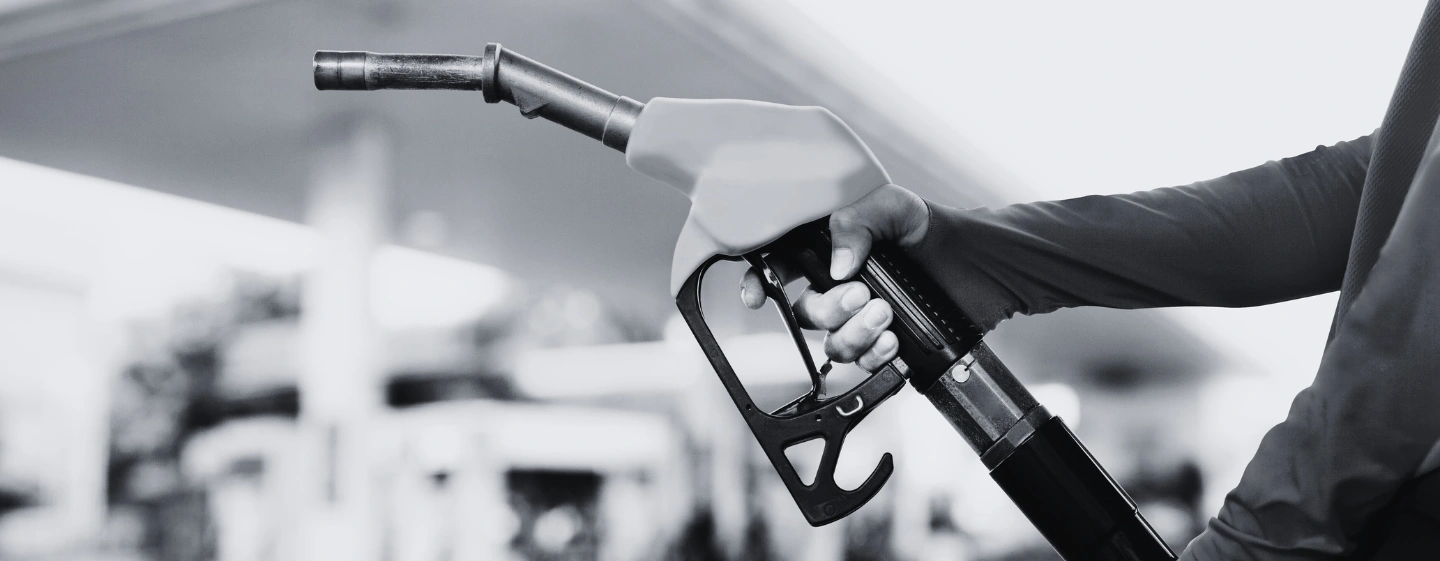 Man holding gas pump. Hero image for 