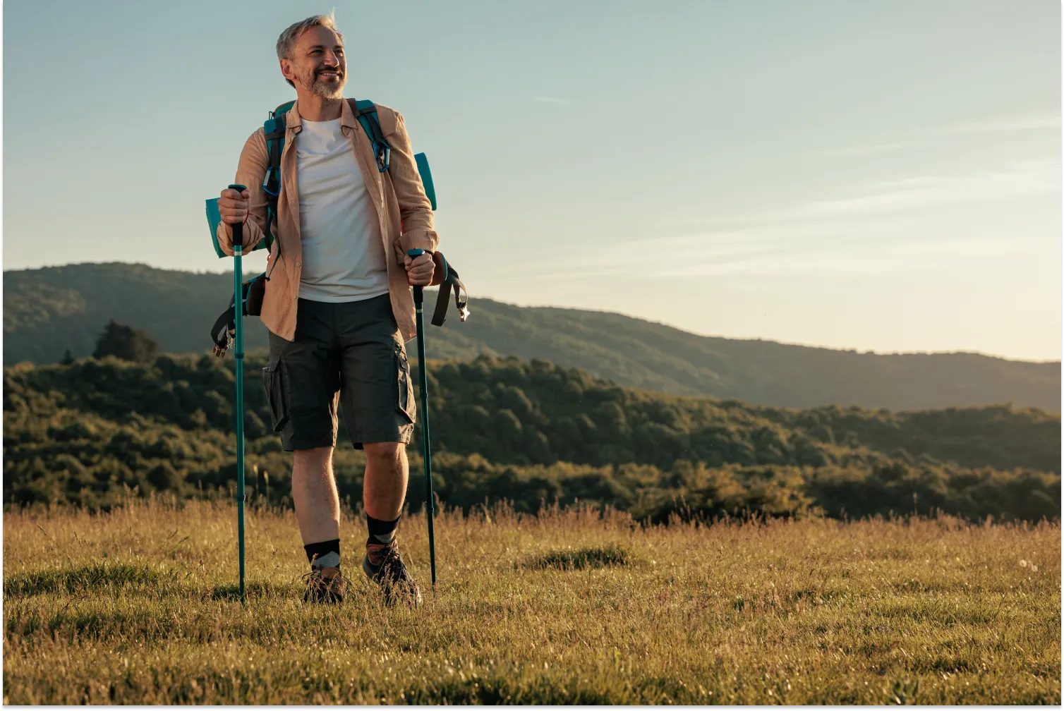 A man walking in the mountain to increase calorie expenditure and maintain metabolic health